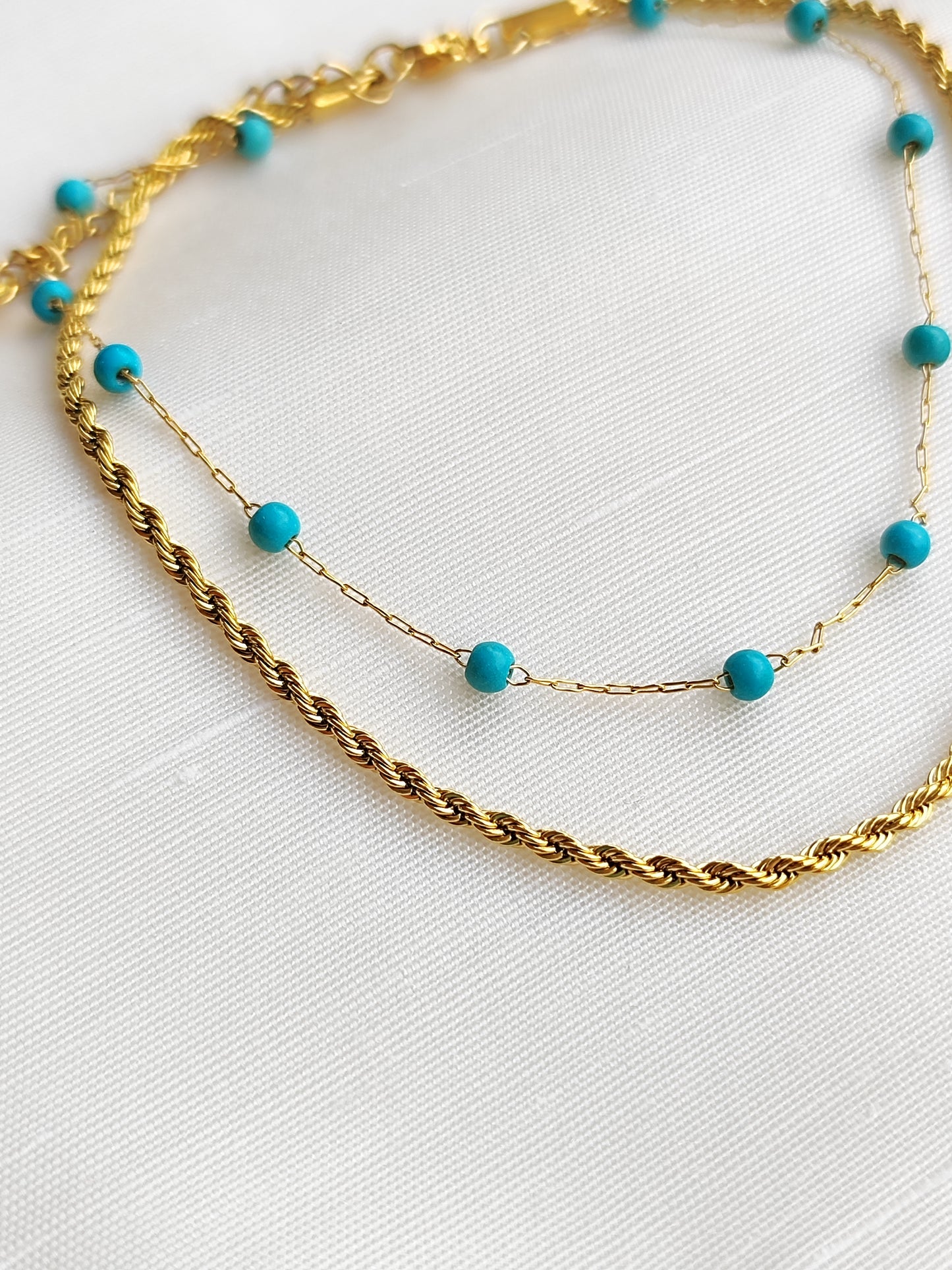 Διπλή πλεκτή αλυσίδα ποδιού με γαλάζιες πέτρες από ανοξείδωτο ατσάλι σε χρώμα χρυσό SSF08g